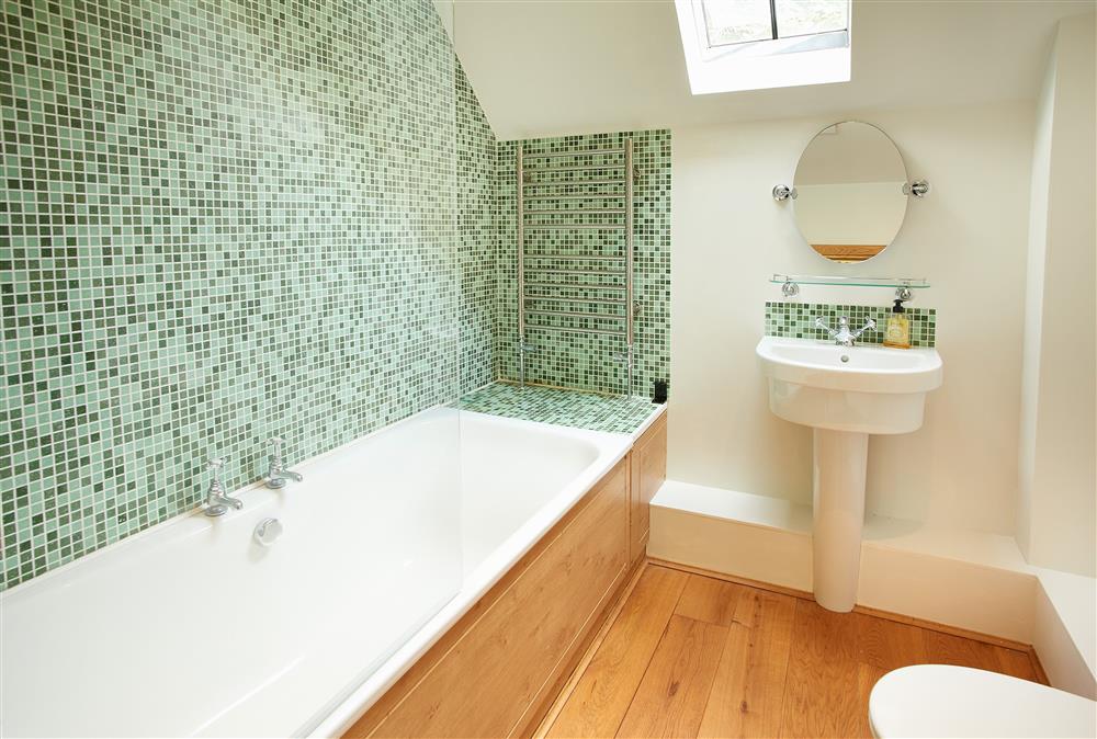 First floor: Family bathroom with bath and over-head shower attachment  at Fron Cottage, Llangynog, Oswestry