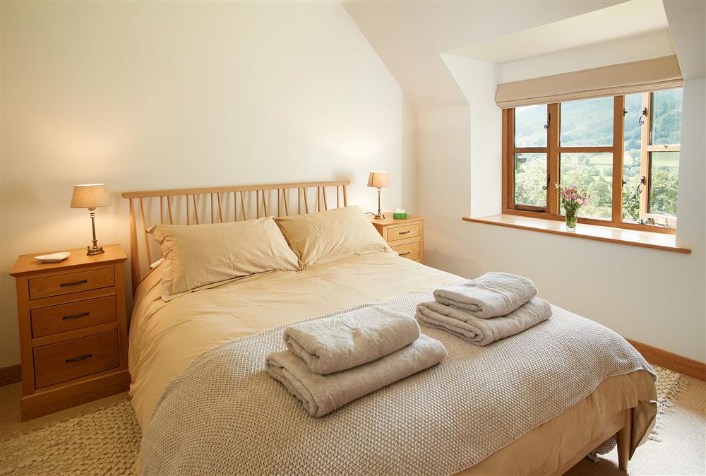 First floor: Master bedroom with a 5ft king-size bed (photo 2) at Fron Cottage, Llangynog, Oswestry