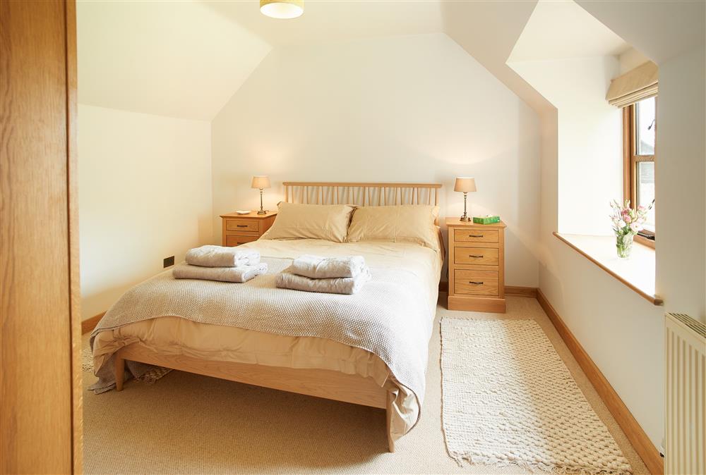 First floor: Master bedroom with a 5ft king-size bed at Fron Cottage, Llangynog, Oswestry