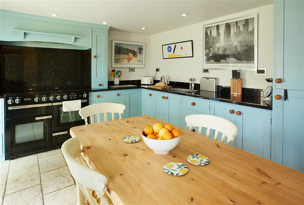 Ground floor: Farmhouse style kitchen with dining area at Fron Cottage, Llangynog, Oswestry