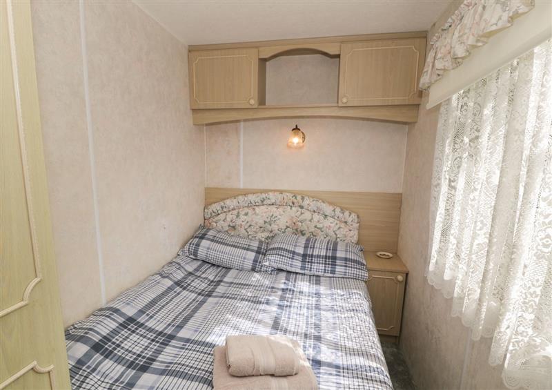 This is a bedroom at Fron Dderw Caravan, Llanfairynghornwy near Llanfechell