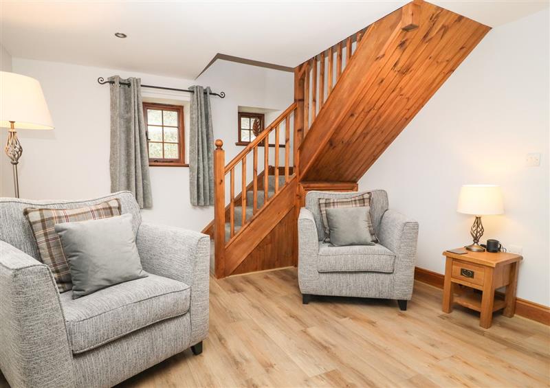 Relax in the living area at Fryston Cottage, Keswick
