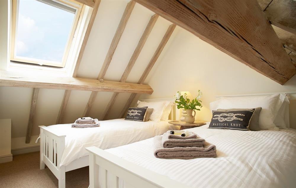 Twin bedroom with 3’ beds and en-suite shower room at Furlong Barn, Long Itchington