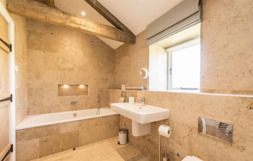 En-suite bathroom with bath and separate walk in shower at Furlongs, Abbotsbury