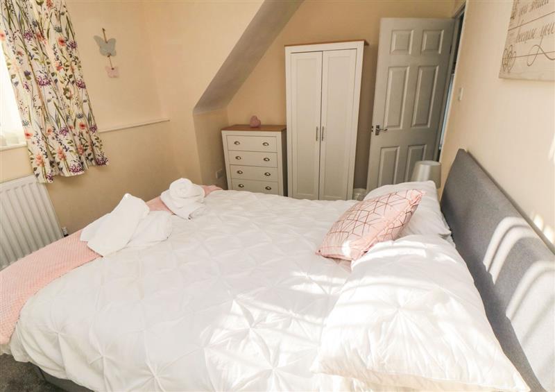 A bedroom in Fuschia Cottage at Fuschia Cottage, Stainsacre near Whitby