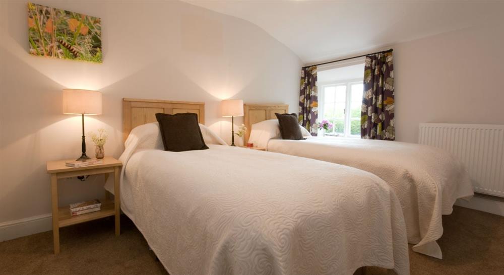 The comfortable twin bedroom at Fyne Court Cottage in Bridgwater, Somerset