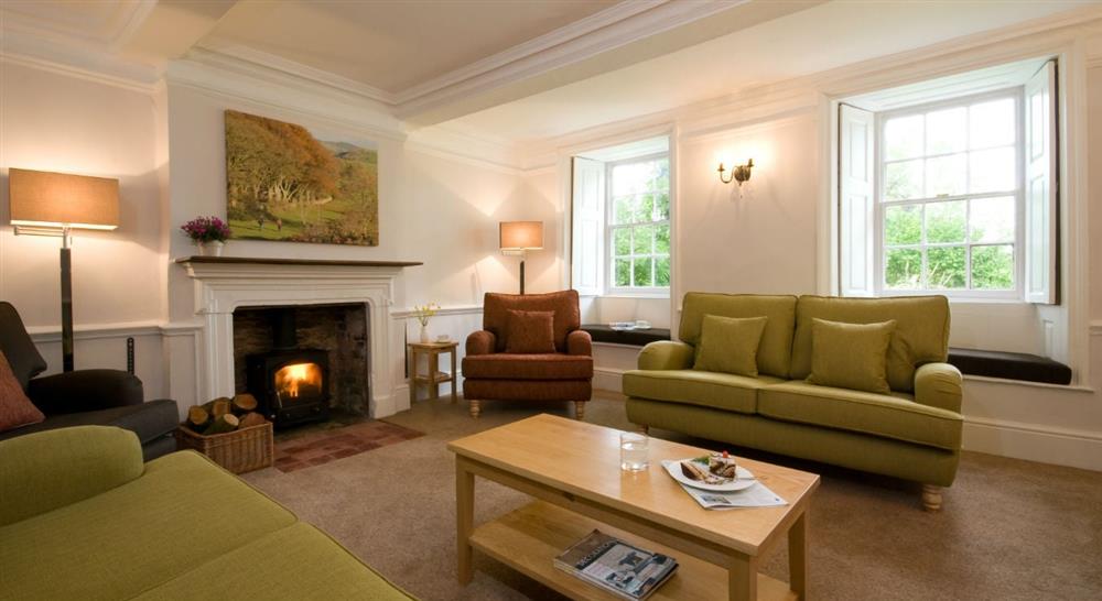The cosy sitting room at Fyne Court Cottage in Bridgwater, Somerset