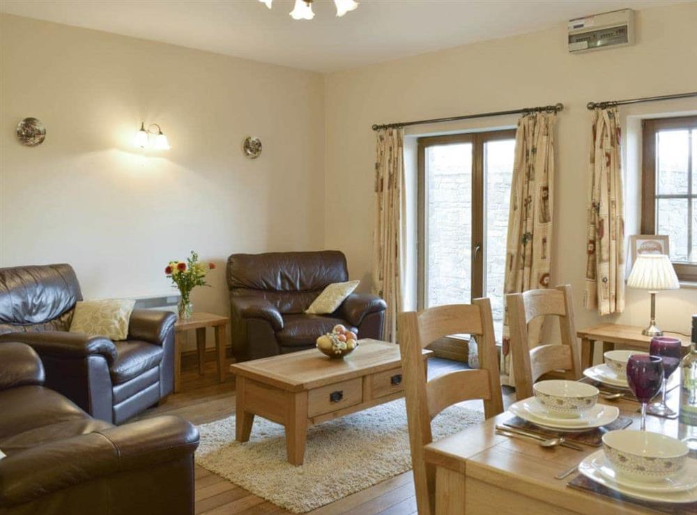 Cosy living and dining area at Tan Y Dderwen, 