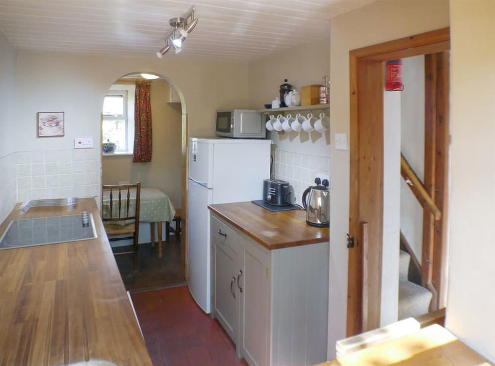 Well-equipped galley-style kitchen at Gable Cottage in Leek, Staffordshire