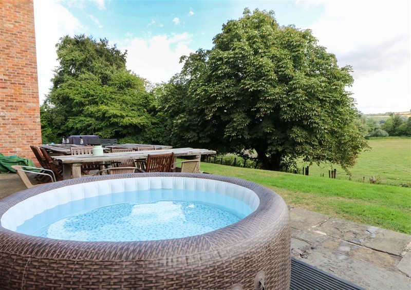 Relax in the hot tub at Gaer Hall, Guilsfield