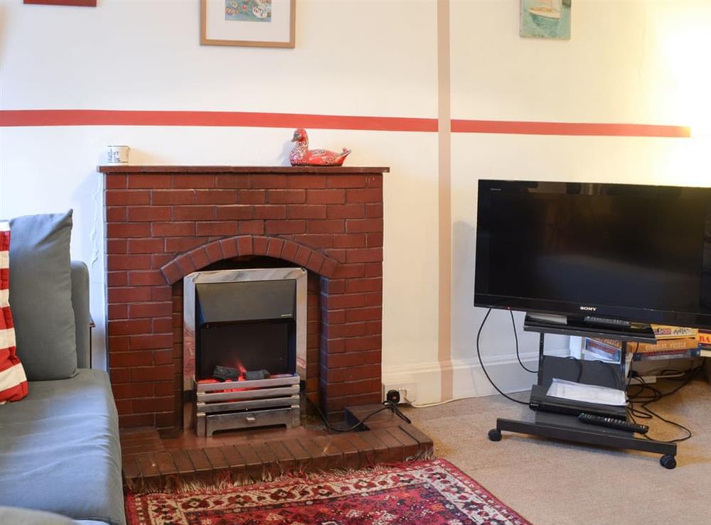 Cosy living room with electric fire & TV at Gaerwen in Criccieth, near Porthmadog, Gwynedd