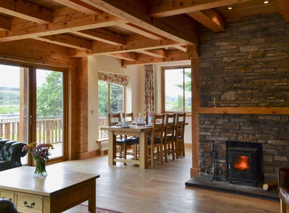 Beamed open-plan living/dining room with wood-burning stove (photo 2) at Gairlochy Bay in Gairlochy, near Fort William., Inverness-Shire