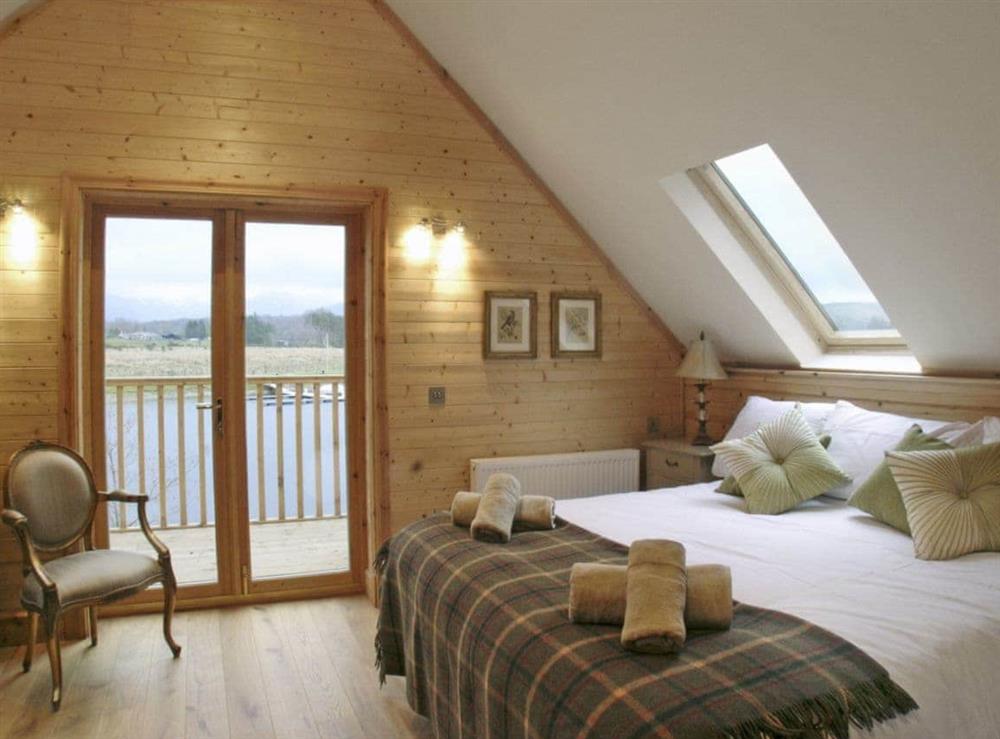 Gorgeous double bedroom with French doors opening out onto the balcony at Gairlochy Bay in Gairlochy, near Fort William., Inverness-Shire