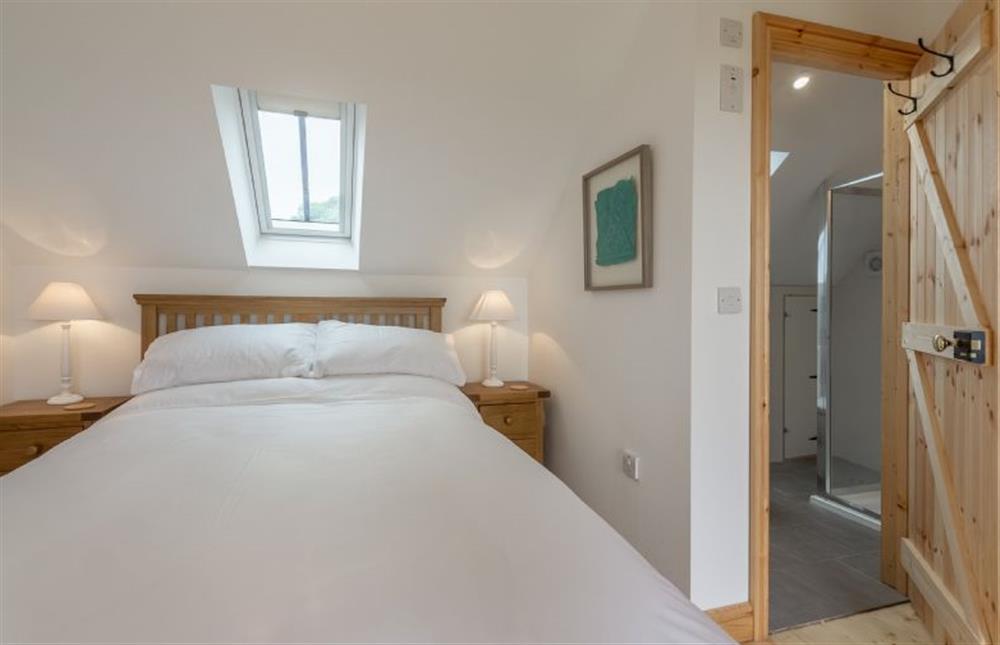 First floor:  Master bedroom with door to en-suite shower room at Gallery Cottage, Wighton near Wells-next-the-Sea