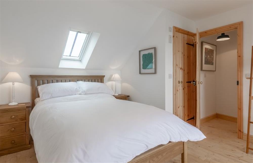 First floor:  Master bedroom with double bed at Gallery Cottage, Wighton near Wells-next-the-Sea