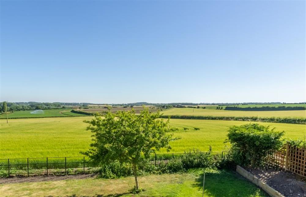 First floor:  Views over the countryside from the Juliette balcony at Gallery Cottage, Wighton near Wells-next-the-Sea
