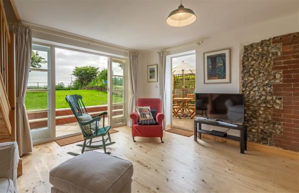 Ground floor:  Sitting area with flatscreen television with DVD at Gallery Cottage, Wighton near Wells-next-the-Sea