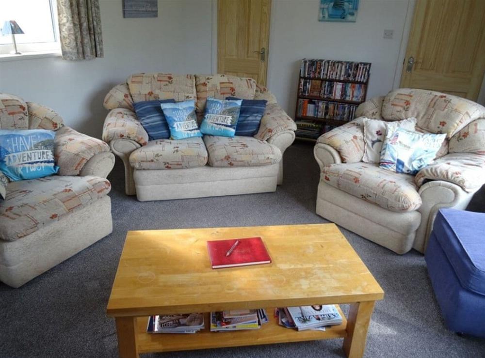 Lounge with a sofa, 2 comfy chairs and a 32 inch TV at Galmpton Farm Close in Galmpton, near Brixham, Devon