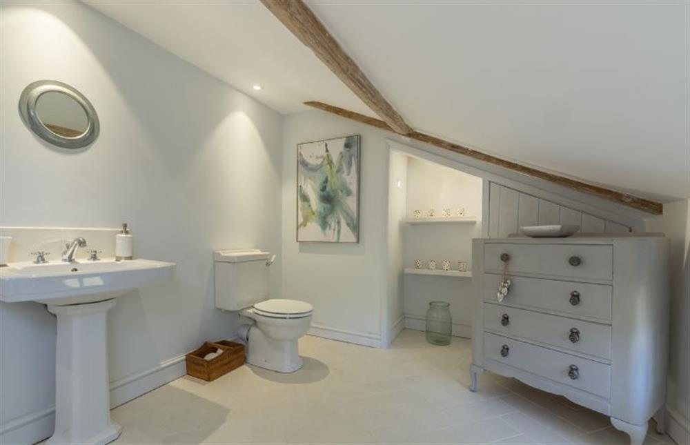 First floor:  En-suite bathroom with wash basin and WC at Gamekeepers Lodge, South Raynham near Fakenham