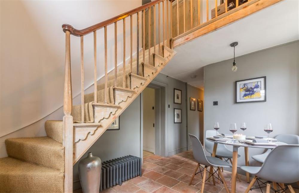 Ground floor:  Dining hall with stairs to first floor at Gamekeepers Lodge, South Raynham near Fakenham