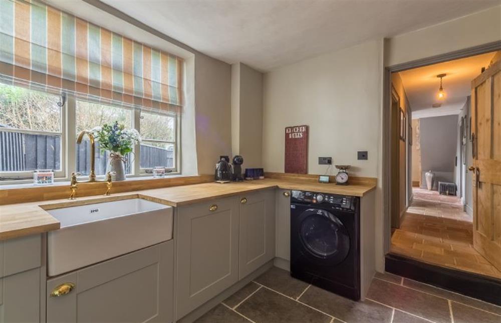 Ground floor:  Kitchen with Butlerfts sink and plenty of counter and cupboard space at Gamekeepers Lodge, South Raynham near Fakenham