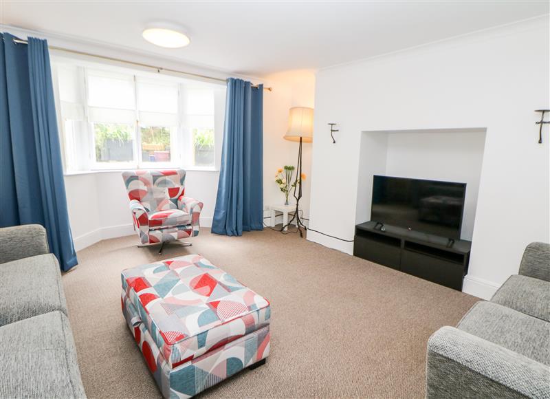 Relax in the living area at Garden Apartment, Buxton