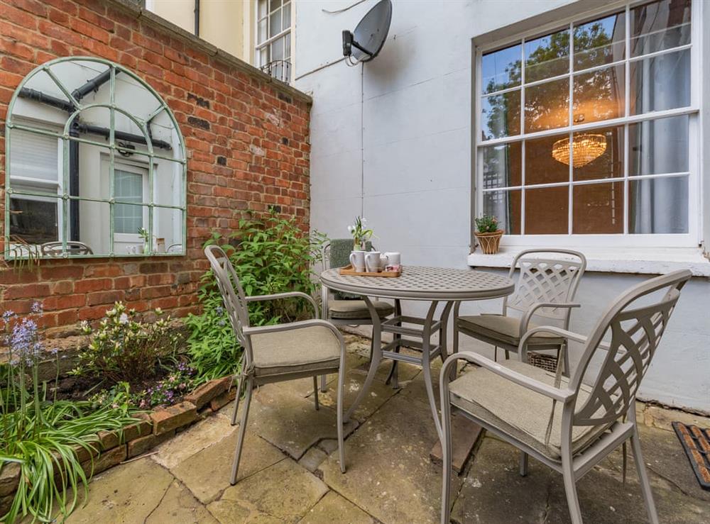 Sitting-out-area at Garden Apartment in Cheltenham, Gloucestershire