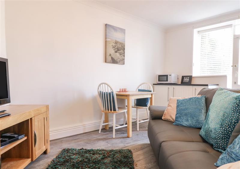 Enjoy the living room at Garden Apartment No1, Rhos-On-Sea