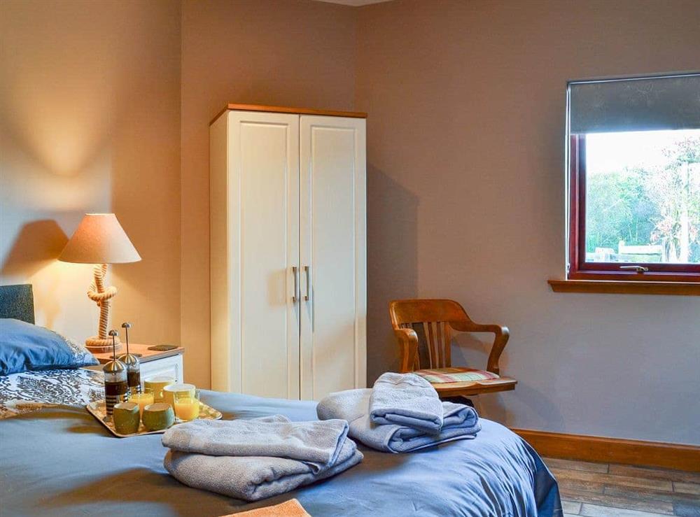 Bedroom with zip and link beds (super kingsize or twin configuration) at Garden Cottage in Coldingham, near Eyemouth, Berwickshire