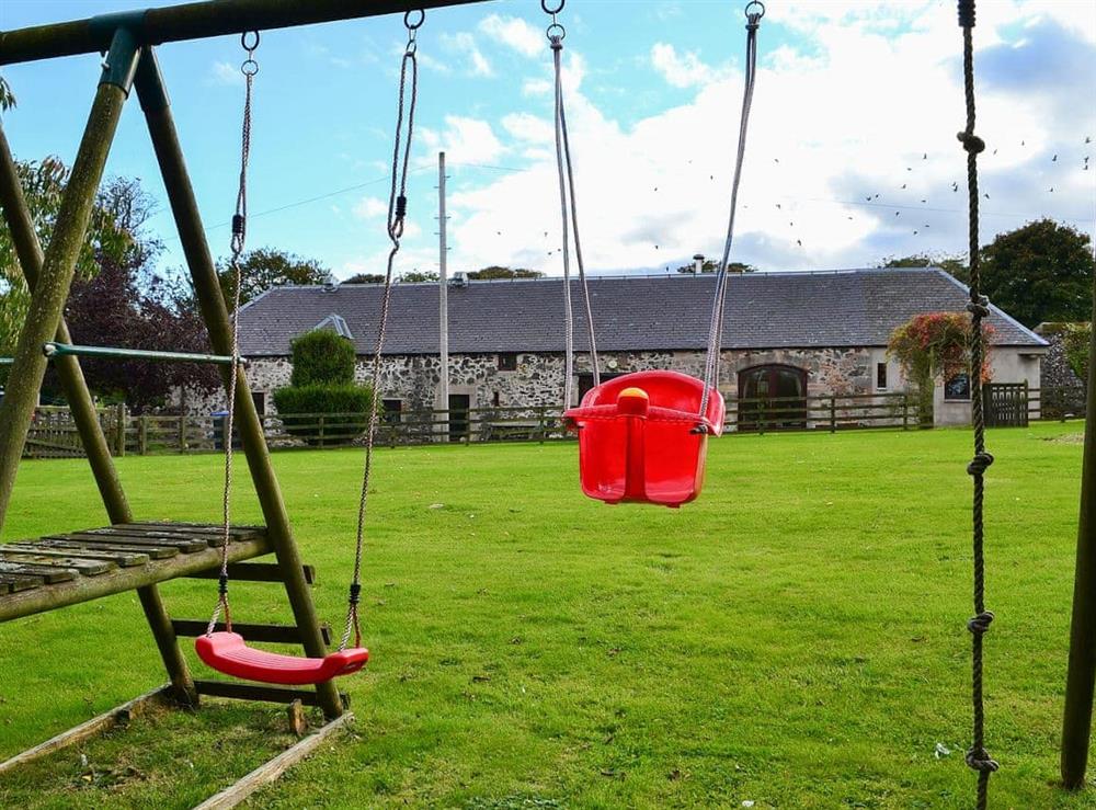 Swing set and children’s play area at Garden Cottage in Coldingham, near Eyemouth, Berwickshire