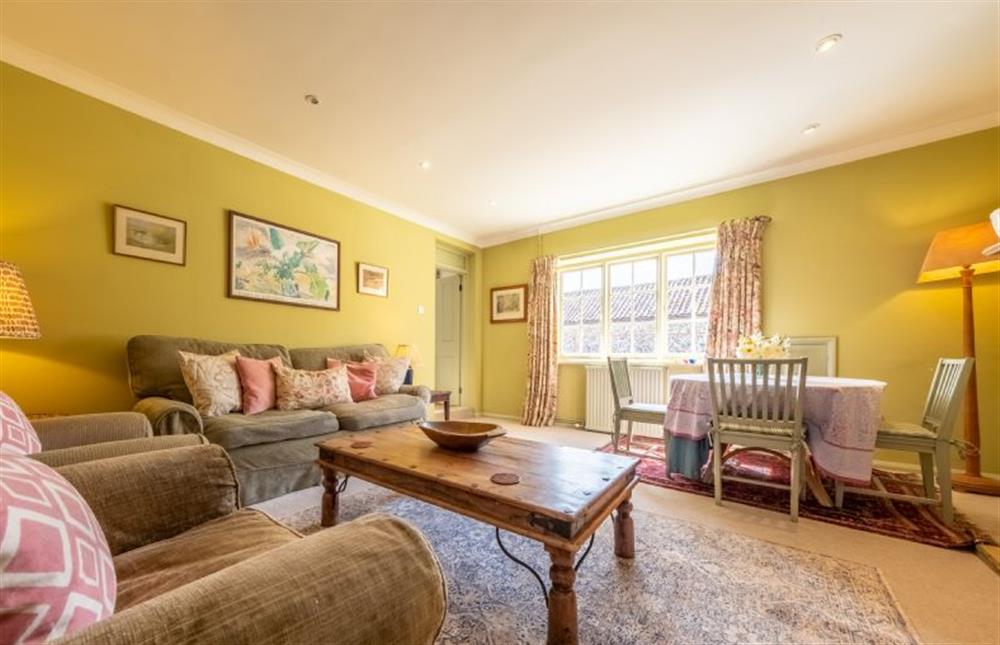 Garden Cottage:  The dining area is also located in the sitting room  at Garden Cottage, East Rudham near Kings Lynn