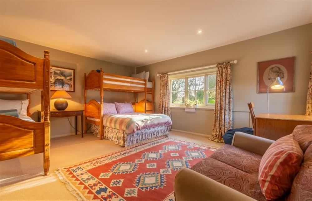 Ground floor: Second bedroom with sofa and views over the farmlands at Garden Cottage, East Rudham near Kings Lynn
