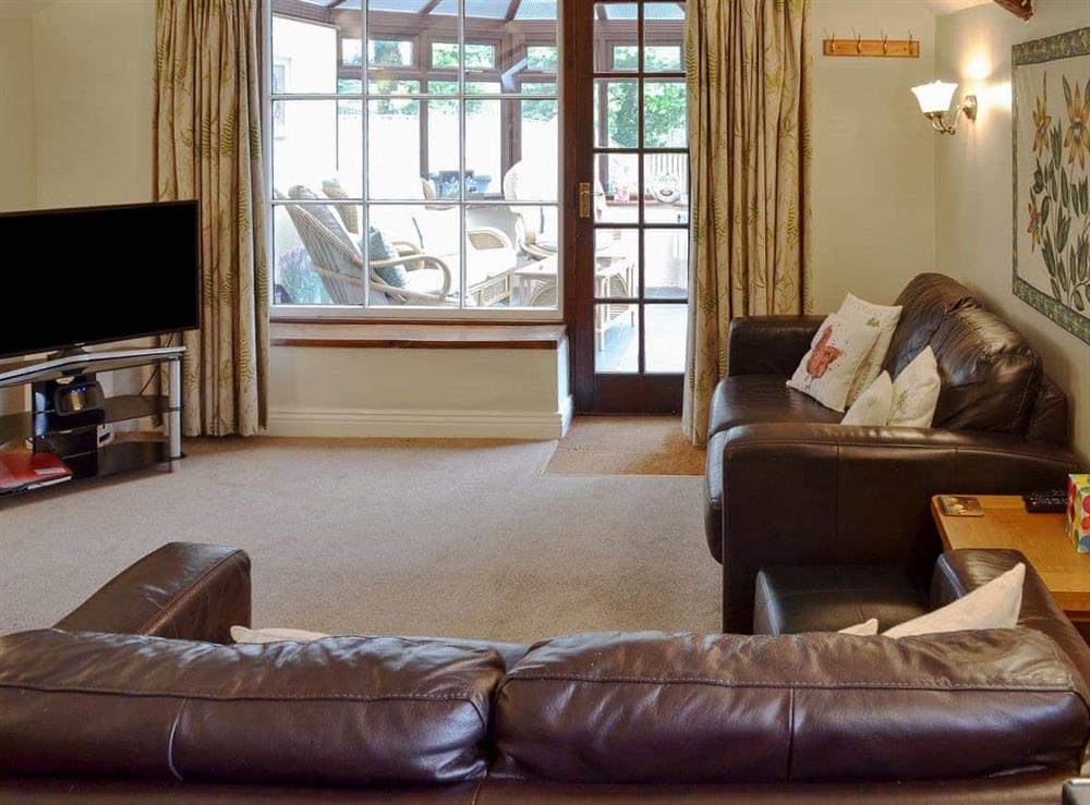 Comfortable living/ dining room at Garden Cottage in Harbertonford, Totnes, Devon