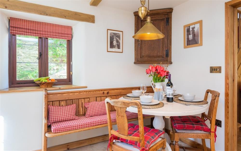 Cosy dining area at Garden Cottage in Loddiswell