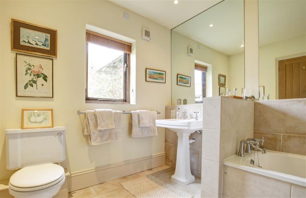 Ground floor:  Bathroom with large mirror at Garden Cottage, Manor House Farm, Wellingham near Kings Lynn
