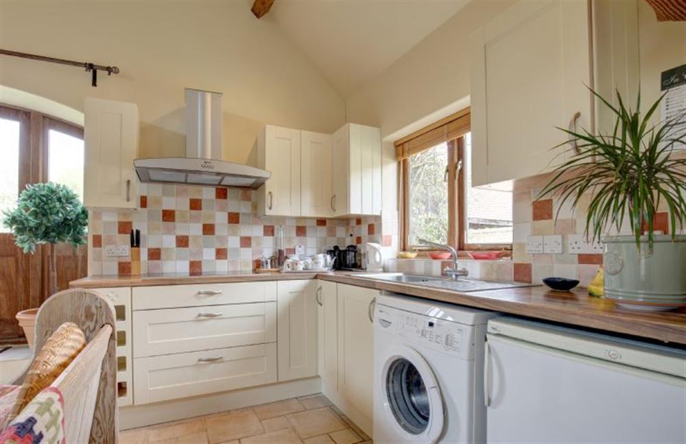 Ground floor:  Kitchen area with oven and ceramic hob at Garden Cottage, Manor House Farm, Wellingham near Kings Lynn