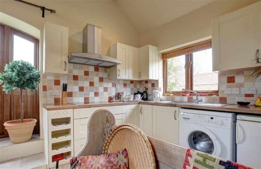 Ground floor:  Kitchen area with washing machine at Garden Cottage, Manor House Farm, Wellingham near Kings Lynn