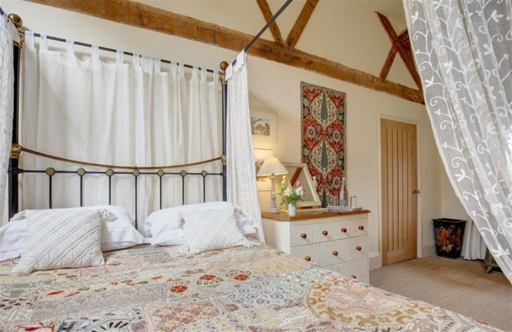 Ground floor:  Master bedroom with vaulted and beamed ceiling at Garden Cottage, Manor House Farm, Wellingham near Kings Lynn