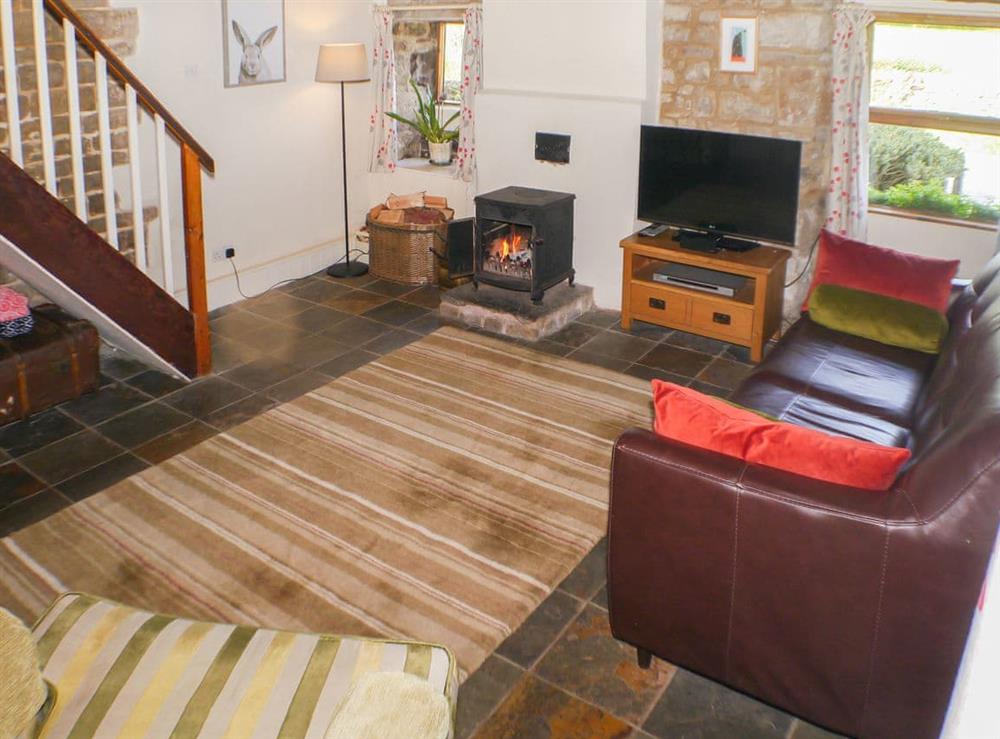 Comfortable and cosy flag-floored living room at Garden Cottage in Onecote, near Leek, Staffordshire