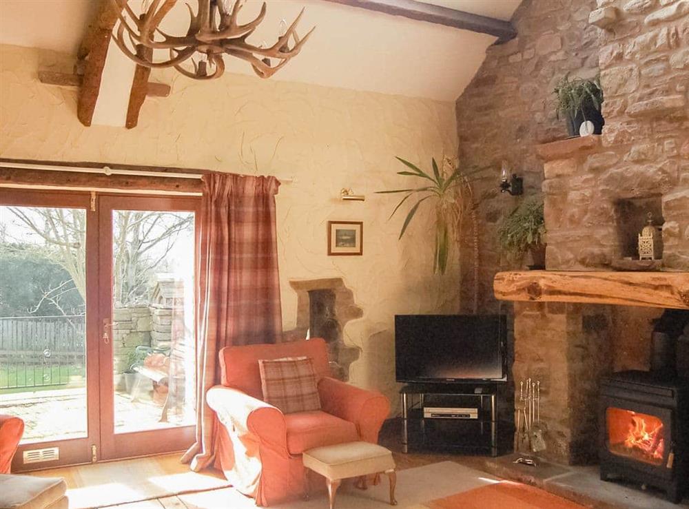 Light and bright living room with patio doors to the garden at Garden Cottage in Pooley Bridge, Ullswater, Cumbria