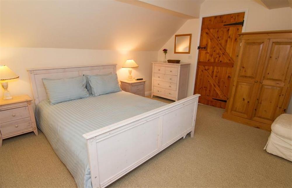 First floor: The Master bedroom king-size bed at Garden Cottage, Ringstead near Hunstanton