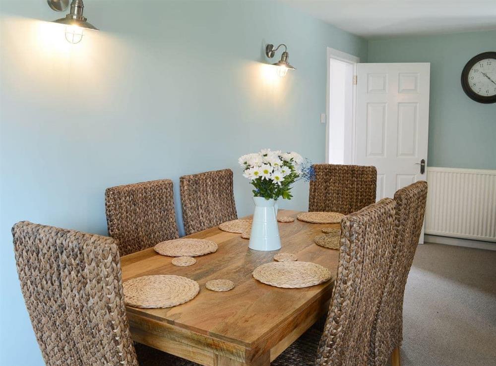 Inviting dining area at Garden Cottage in Tain, Highlands, Ross-Shire