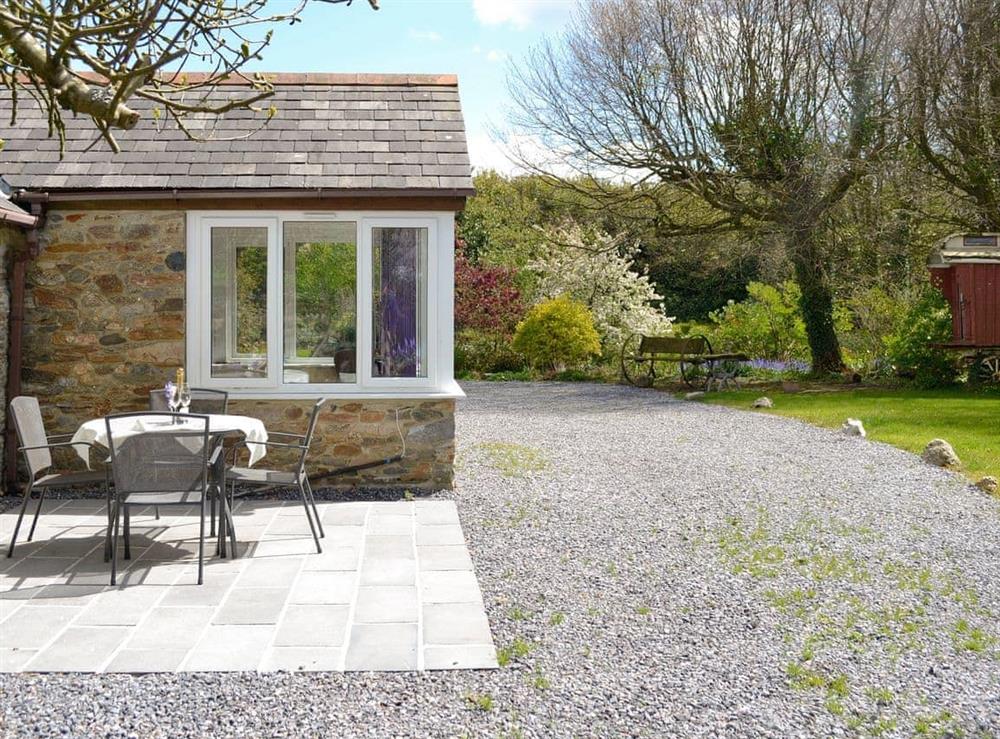 Exquisite holiday home with garden furniture on patio at Garden Cottage in Ugborough, near Ivybridge, Devon