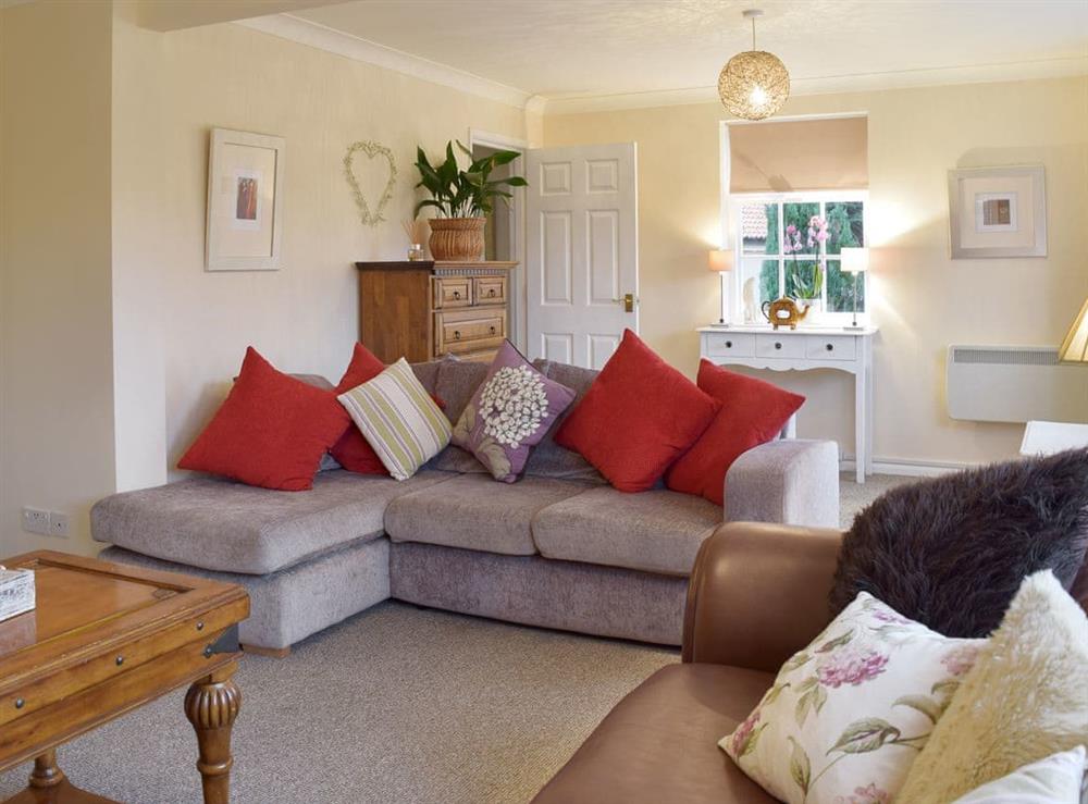 Cosy seating in the living room at Garden Cottage in Wangford, near Southwold, Suffolk, England