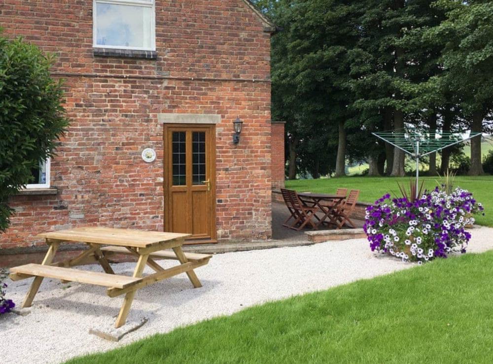 Outdoor furniture on side and rear patios at Garden Farm Cottage in Ilam, Nr Ashbourne, Derbyshire., Staffordshire