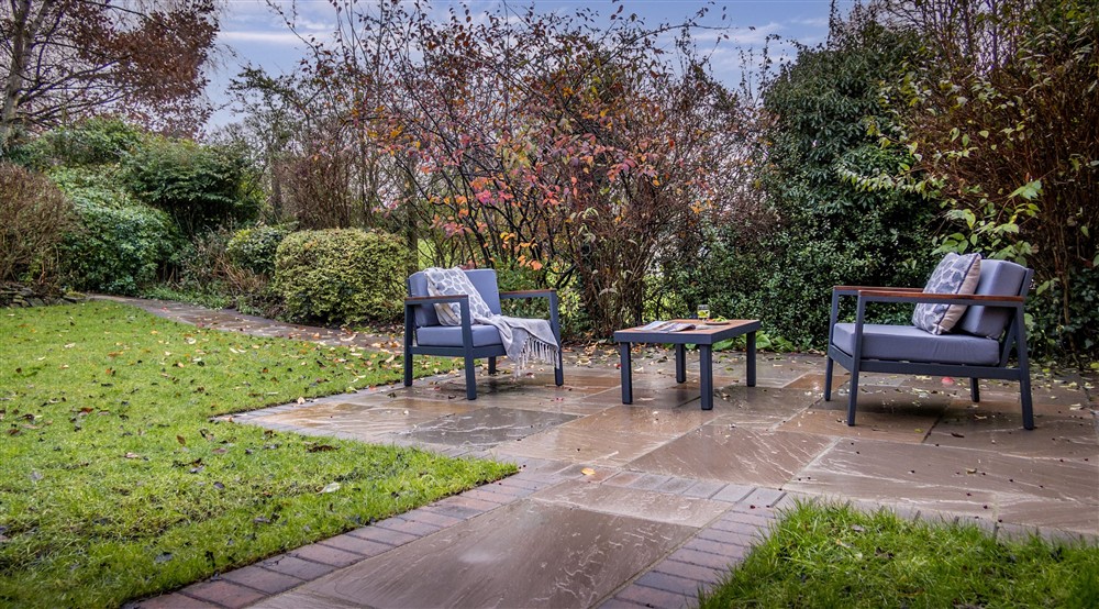 The private garden, with lawn, patio and outdoor furniture, for guests staying (photo 2) at Garden Gate Apartment in Durham, County Durham
