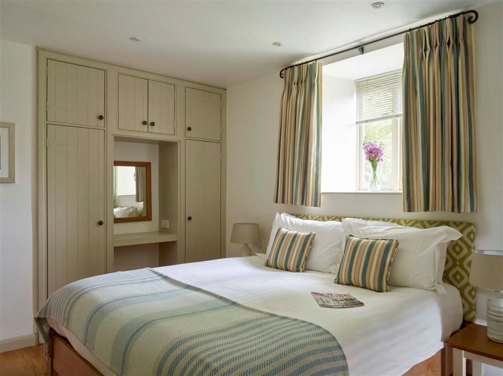 Bedroom one, with a 6’ super-king size bed at Garden House, Dartmouth