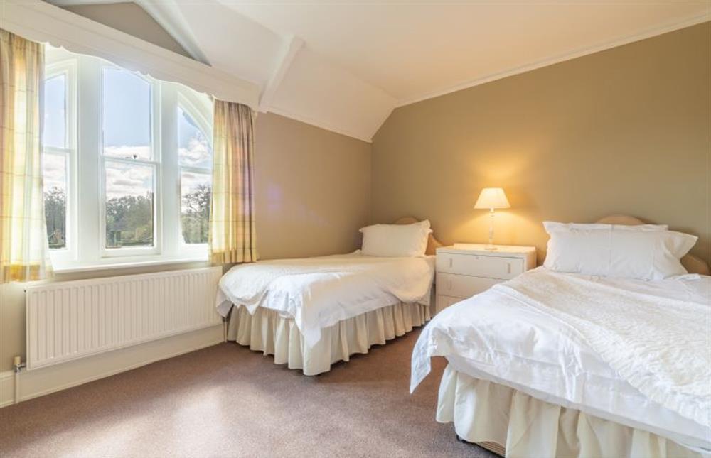 First floor: Bedroom two with zip \u0026 link super-king / twin beds at Garden House, Sandringham