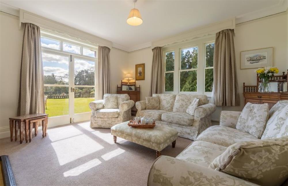 Ground floor: The sitting room has doors leading to the patio at Garden House, Sandringham