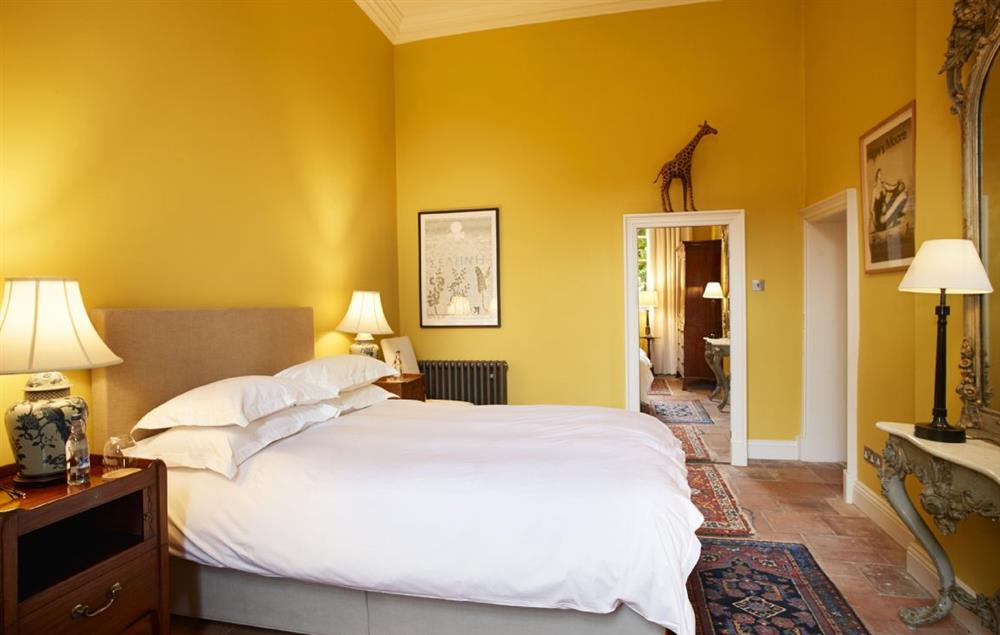 Bedroom one on the ground floor with zip and link king-size bed and en-suite at Garden House, Wolterton
